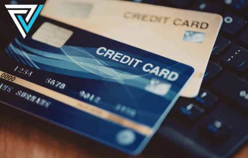 Debt collection payment processing — credit cards on a keyboard representing card acceptance for collection agencies